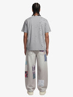 Vintage Wash Collage Print Curved Leg Denim Jeans