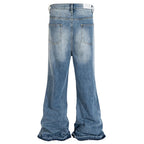 Blue Ripped Denim Flare Jeans — front view