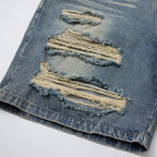 Vintage Ripped Denim Shorts — fabric close-up