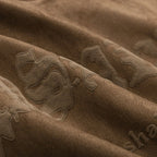 Skeleton Wings Graphic Suede Loose T-Shirt — fabric close-up