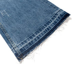 Blue Ripped Denim Flare Jeans — fabric close-up