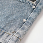 Vintage Blue Plaid Ripped Denim Shorts — fabric close-up