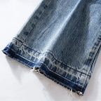 Red Denim Flare Ripped Jeans — fabric close-up