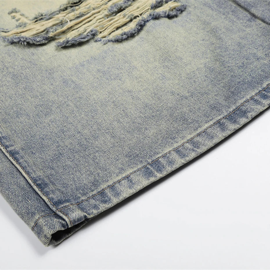 Vintage Blue Ripped Mid Rise Denim Shorts — fabric close-up