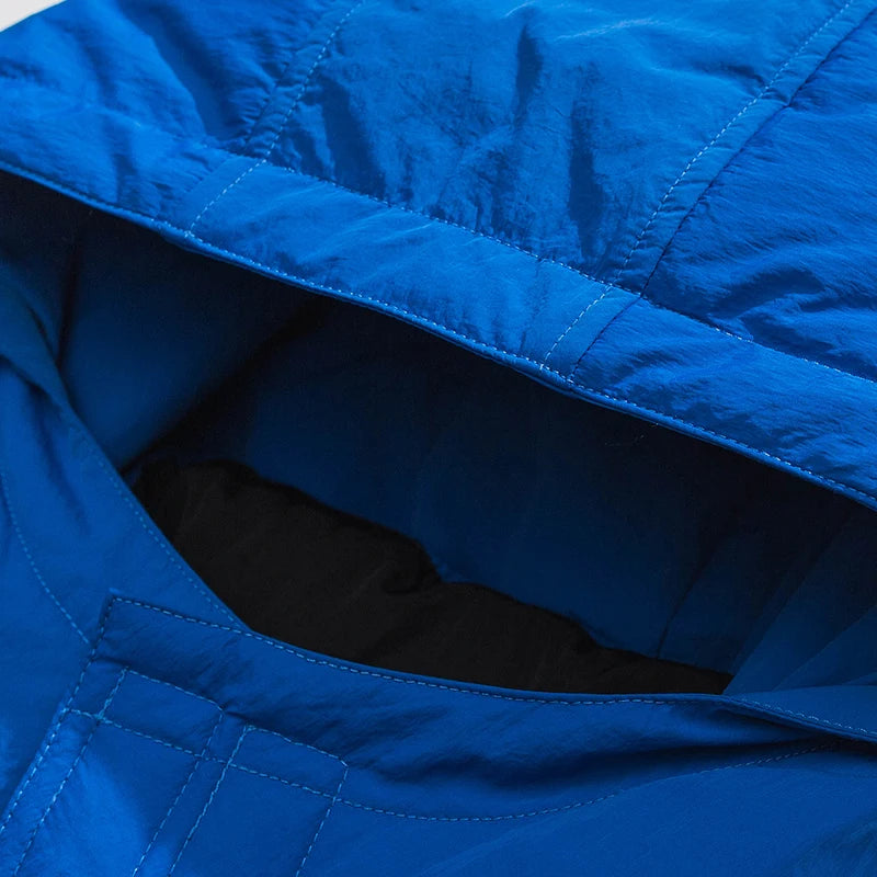 Blue Letter Hooded Puffer Jacket — fabric close-up