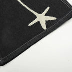 Black Star Embroidered Loose Denim Shorts — fabric close-up