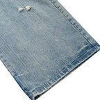 Vintage Blue Ripped Denim Baggy Jeans — fabric close-up