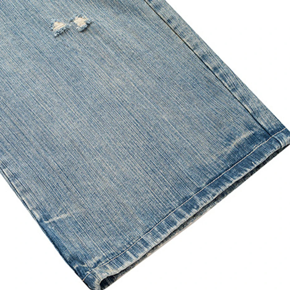 Vintage Blue Ripped Denim Baggy Jeans — fabric close-up